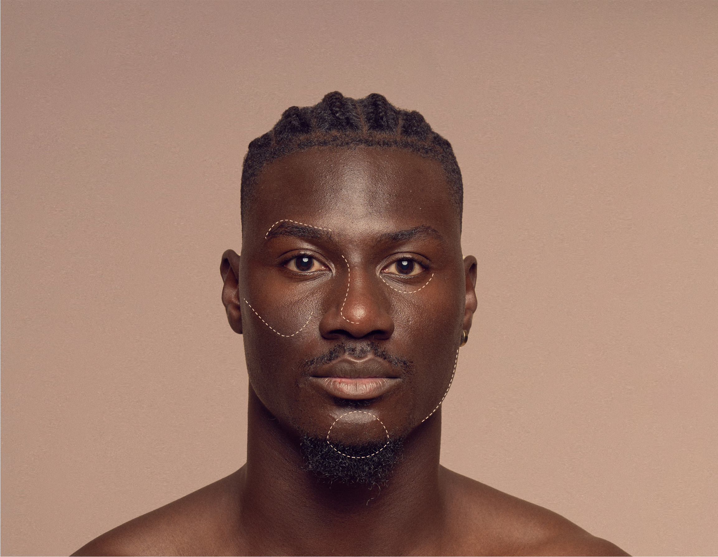 A man with braided hair against a neutral background, adorned with artistic golden patterns on his face. He has a focused expression, and the patterns accentuate his features, adding an elegant and unique touch to the portrait.